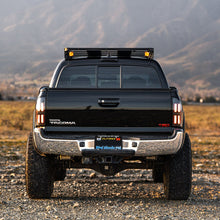 Load image into Gallery viewer, AlphaRex LED Tail Lights for Toyota Tacoma (2005-2015) Prismatic Nova Series with Sequential Signal - Alpha Black / Black Alternate Image