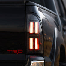 Load image into Gallery viewer, AlphaRex LED Tail Lights for Toyota Tacoma (2005-2015) Prismatic Nova Series with Sequential Signal - Alpha Black / Black Alternate Image