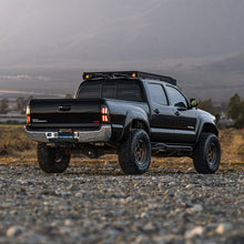 Load image into Gallery viewer, AlphaRex LED Tail Lights for Toyota Tacoma (2005-2015) Prismatic Nova Series with Sequential Signal - Alpha Black / Black Alternate Image