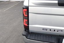 Load image into Gallery viewer, AlphaRex LED Tail Lights for Ford F250 F350 F450 F550 Super Duty (2017-2019) Pro Series with Blinking Signal - Jet Black / Red Smoke Alternate Image