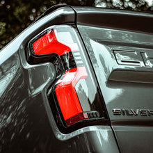 Load image into Gallery viewer, AlphaRex LED Tail Lights for Chevy Silverado 1500 (19-26) 2500HD / 3500HD (20-26) Luxx Series with Sequential Signal - Alpha Black / Black / Black Red Alternate Image