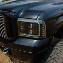 Load image into Gallery viewer, AlphaRex LED Projector Headlights Ford Excursion (05-07) [LUXX Series - DRL Light Tube] Black or Alpha-Black Alternate Image