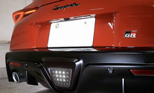 Load image into Gallery viewer, REVEL GT Dry Carbon Fiber Toyota GR Supra (2020) Reverse Light Cover Alternate Image