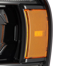 Load image into Gallery viewer, AlphaRex LED Projector Headlights Dodge Ram (02-05) LUXX Series - Sequential Turn Signal - Black / Chrome / Alpha-Black - Black Alternate Image