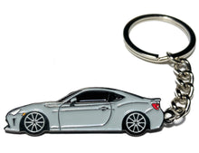 Load image into Gallery viewer, Car-shaped keychain on a white background Alternate Image