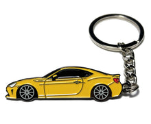 Load image into Gallery viewer, Yellow car-shaped keychain on a white background Alternate Image