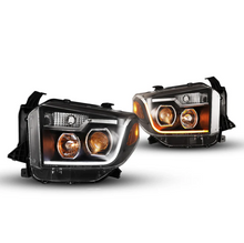 Load image into Gallery viewer, Winjet Headlights for Toyota Tundra (2014-2021) With Sequential Turn Signal - Black Housing with Clear Lens CHRNG0376-B-SQ - Default Title Alternate Image