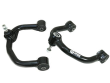 Load image into Gallery viewer, Two black suspension control arms on a white background Alternate Image