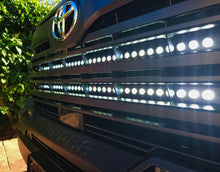 Load image into Gallery viewer, M&amp;R Automotive dual 40-inch LED light bars behind the grille of a 2022-2026 Toyota Tundra 3rd Gen Alternate Image