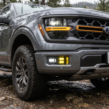 Load image into Gallery viewer, M&amp;R Automotive four-pod LED fog light kit installed on a 2024-2026 Ford F-150 Tremor with standard bumper Alternate Image