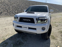 Load image into Gallery viewer, AlphaRex Dual LED Projector Headlights Toyota Tacoma [LUXX Series - DRL Light Tube] (05-11) Alpha-Black / Black / Chrome - Alpha-Black / With Converter Alternate Image
