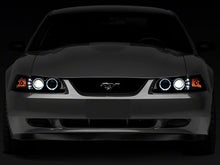 Load image into Gallery viewer, Raxiom Projector Headlights Ford Mustang SN95 (99-04) [Dual LED Halo] Chrome Housing/ Clear Lens or Black Housing/ Smoked Lens Alternate Image