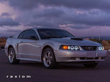 Load image into Gallery viewer, Raxiom Projector Headlights Ford Mustang SN95 (99-04) [Dual LED Halo] Chrome Housing/ Clear Lens or Black Housing/ Smoked Lens Alternate Image