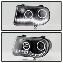 Load image into Gallery viewer, Xtune Projector Headlights Chrysler 300C (05-10) [w/ Halo LED Lights] Black or Chrome w/ Amber Turn Signal Light - Black Alternate Image