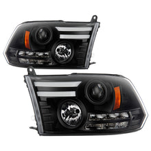 Load image into Gallery viewer, Spyder Projector Headlights Dodge Ram 1500 (09-18) 2500/3500 (10-19) CCFL Halo / LED Halo / Light Bar DRL / V2 Light Bar DRL / V2 Switch Back - with Light Bar DRL - Black Alternate Image
