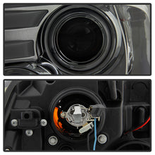Load image into Gallery viewer, Spyder Projector Headlights Dodge Ram 1500 (09-18) 2500/3500 (10-19) CCFL Halo / LED Halo / Light Bar DRL / V2 Light Bar DRL / V2 Switch Back - with CCFL Halo - Black Smoke Alternate Image
