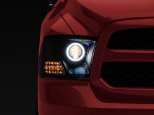Load image into Gallery viewer, Raxiom Projector Headlights Dodge Ram 1500 Factory Halogen (09-18) Black Housing/ Clear Lens - Super White LED Halo Alternate Image