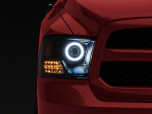 Load image into Gallery viewer, Raxiom Projector Headlights Dodge Ram 1500 Factory Halogen (09-18) Black Housing/ Clear Lens - Super White LED Halo Alternate Image