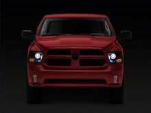 Load image into Gallery viewer, Raxiom Projector Headlights Dodge Ram 1500 Factory Halogen (09-18) Black Housing/ Clear Lens - Super White LED Halo Alternate Image
