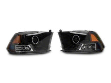 Load image into Gallery viewer, Raxiom Projector Headlights Dodge Ram 1500 Factory Halogen (09-18) Black Housing/ Clear Lens - Super White LED Halo Alternate Image