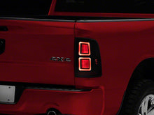 Load image into Gallery viewer, Raxiom Tail Lights Dodge Ram 1500 (09-18) [w/ Factory Halogen Lights] Black Housing / Smoked Lens Alternate Image