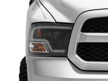 Load image into Gallery viewer, Raxiom Projector Headlights Dodge Ram 1500 Factory Halogen (09-18) Black Housing/ Clear Lens - Super White LED Halo Alternate Image