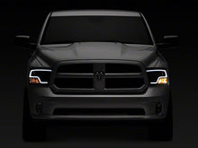 Load image into Gallery viewer, Raxiom Projector Headlights Dodge Ram 1500 Factory Halogen (09-18) Black Housing/ Clear Lens - Super White LED Halo Alternate Image