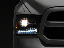 Load image into Gallery viewer, Raxiom Projector Headlights Dodge Ram 1500 Factory Halogen (09-18) [OE-Style] w/ LED Halo &amp; Switchback Turn Signals Alternate Image
