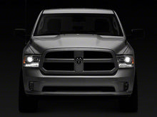 Load image into Gallery viewer, Raxiom Projector Headlights Dodge Ram 1500 Factory Halogen (09-18) [OE-Style] w/ LED Halo &amp; Switchback Turn Signals Alternate Image
