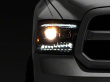 Load image into Gallery viewer, Raxiom Projector Headlights Dodge Ram 1500 Factory Halogen (09-18) Black Housing/ Clear Lens - Super White LED Halo Alternate Image