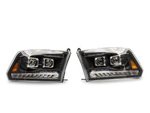 Load image into Gallery viewer, Raxiom Projector Headlights Dodge Ram 1500 Factory Halogen (09-18) Black Housing/ Clear Lens - LED DRL w/ Switchback Turn Signals Alternate Image