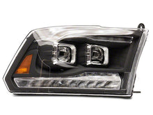 Load image into Gallery viewer, Raxiom Projector Headlights Dodge Ram 1500 Factory Halogen (09-18) Black Housing/ Clear Lens - Super White LED Halo Alternate Image