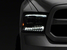 Load image into Gallery viewer, Raxiom Projector Headlights Dodge Ram 1500 Factory Halogen (09-18) Black Housing/ Clear Lens - Super White LED Halo Alternate Image
