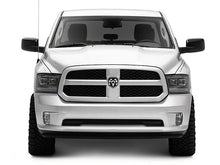 Load image into Gallery viewer, Raxiom Projector Headlights Dodge Ram 1500 Factory Halogen (09-18) Black Housing/ Clear Lens Alternate Image