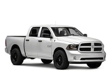 Load image into Gallery viewer, Raxiom Projector Headlights Dodge Ram 1500 Factory Halogen (09-18) Black Housing/ Clear Lens Alternate Image