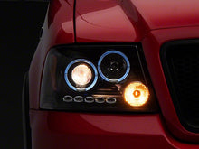 Load image into Gallery viewer, Raxiom Projector Headlights Ford F150 (04-08) [Dual LED Halo DRL] Black Housing/ Clear Lens - Default Title Alternate Image