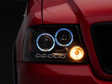 Load image into Gallery viewer, Raxiom Projector Headlights Ford F150 (04-08) [Dual LED Halo DRL] Black Housing/ Clear Lens - Default Title Alternate Image