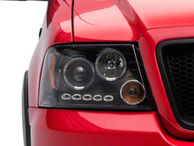 Load image into Gallery viewer, Raxiom Projector Headlights Ford F150 (04-08) [Dual LED Halo DRL] Black Housing/ Clear Lens - Default Title Alternate Image