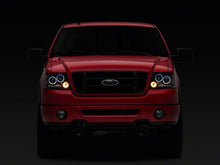 Load image into Gallery viewer, Raxiom Projector Headlights Ford F150 (04-08) [Dual LED Halo DRL] Black Housing/ Clear Lens - Default Title Alternate Image