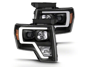 Raxiom Projector Headlights Ford F150 Factory Halogen (09-14) Black Housing/ Clear Lens