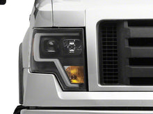 Load image into Gallery viewer, Raxiom Projector Headlights Ford F150 Factory Halogen (09-14) Black Housing/ Clear Lens Alternate Image