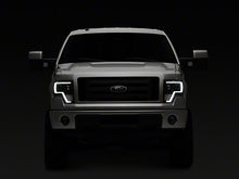 Load image into Gallery viewer, Raxiom Projector Headlights Ford F150 Factory Halogen (09-14) Black Housing/ Clear Lens Alternate Image