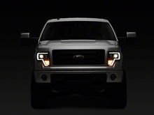 Load image into Gallery viewer, Raxiom Projector Headlights Ford F150 Factory Halogen (09-14) Black Housing/ Clear Lens Alternate Image