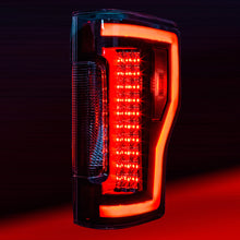 Load image into Gallery viewer, Winjet Renegade LED Tail Lights Ford F250 F350 F450 (17-19) w/ LED Lightbars &amp; Sequential Turn Signals - Black / Clear Alternate Image